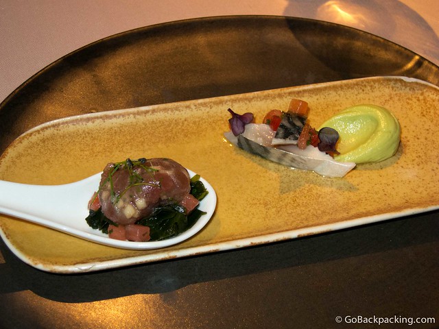 (Left) Tuna sphere "Balfego" with algae and fennel, and (Right) Marinated mackerel with avocado cream and almond vinaigrette
