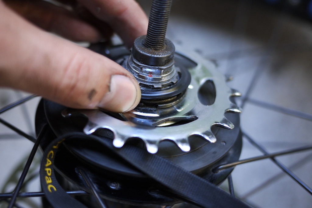 Removing cover over snapring for cog removal on a Shimano Alfine 8 Speed Internal Gear Hub (IGH)