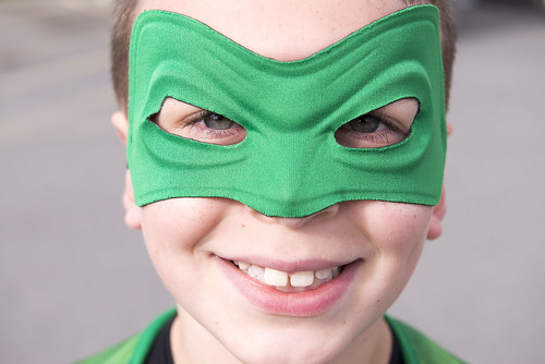 Brooklyn Stewart, 8, is all smiles as the Green Lantern before the start of Saturday's CASA Superhero 5-kilometer run/walk. The Superhero Race was his first 5k.