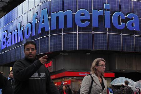 People walk next to a Bank of America's branch in New York