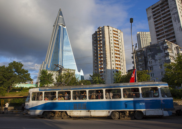 Tramway Passing In Front Of Ryugyong Hotel, Pyongyang, North Korea