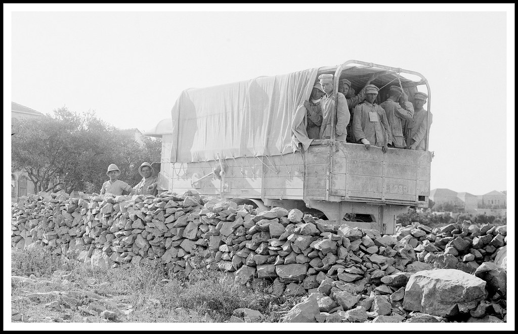British Army convoy of Peerless trucks carrying German POW's  prisoners of war , possibly in Palestine- circa 1917