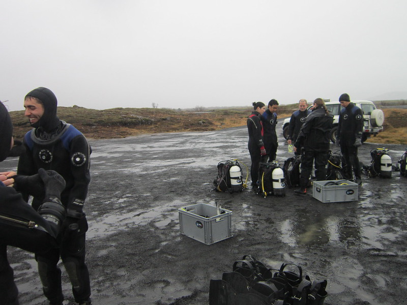 Snorkelers and divers prep for the Silfra Rift in Thingvellir Park, Iceland