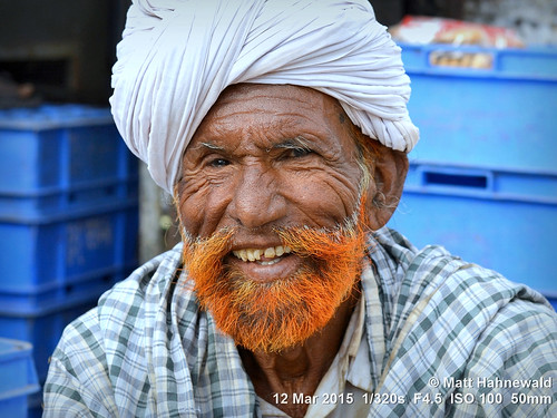 photo primelens portrait cultural character teeth mouth consent travel male ethnic posing rugged handsome henna pagari authentic orange closeup street color eyes traditional matthahnewaldphotography face facingtheworld wrinkles barriephotoclub colorful elderly horizontal 4x3 head india indian jaisalmer nikond3100 outdoor rajasthan turban 50mm oneperson livedinface seveneighthsview expression headshot nikkorafs50mmf18g lookingcamera