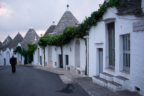 street old morning travel flowers roof sky italy white house building brick heritage history tourism beautiful stone architecture fairytale night sunrise countryside town construction italian europe mediterranean european village cone path traditional country violet culture landmark unesco southern tradition trulli puglia trullo alberobello italt bricked