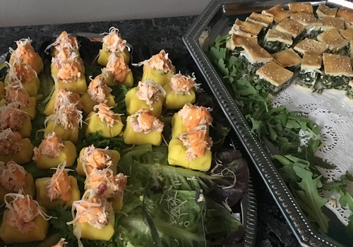 Causita Bites: Chilled aji infused potato topped with guacamole and salmon salad