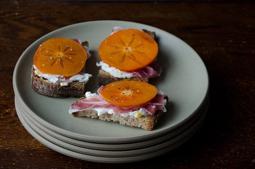 crostini with whipped ricotta, persimmon, and prosciutto