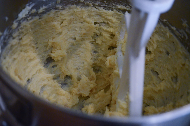 Butter and almond paste being mixed together in a stand mixer.