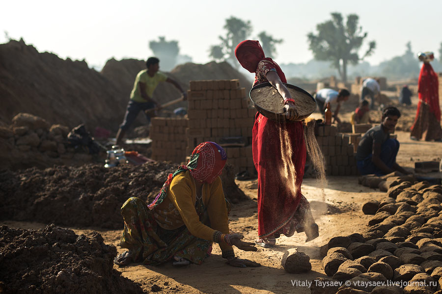 Women carry sand for brick production, Rajhastan