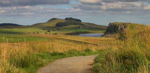 crag lough sycamore gap hadrians wall northumberland northumbria travel trip england english uk united kingdom great britain british september summer landscape view scenic scenery countryside grass lake rock rocks farm hills trees woodland sheep shadow light cliff cliffs sky blue green cloud clouds outside outdoors canon 70d path pathway