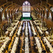 ornate interior of Harvard's Memorial Hall converted for banquet