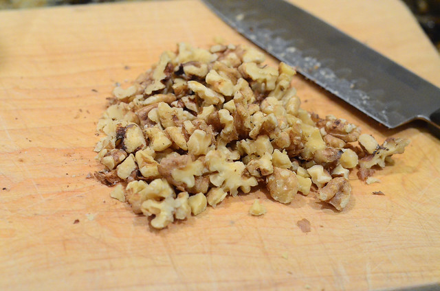 The toasted walnuts are chopped up.