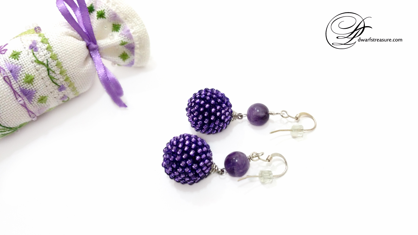 elegant ultraviolet beaded bead earrings with cross stitch needle roll