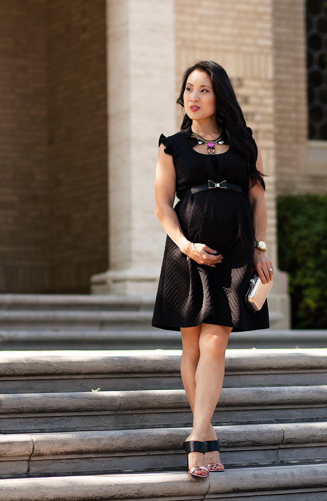 cute & little blog | petite fashion | maternity baby bump pregnant | maternal america quilted black ruffle shift dress, bow belt, gold black sandal pumps, loren hope carina necklace | holiday dress outfit | third trimester 27 weeks