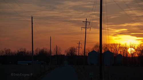 blue sunset sky orange silhouette sign clouds tracks indiana utilitypole railroadcrossing