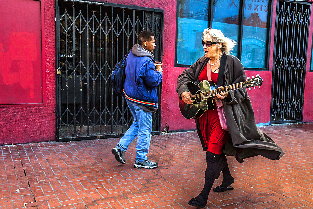 Woman-in-red-dress-playing-guitar--San-Francisco