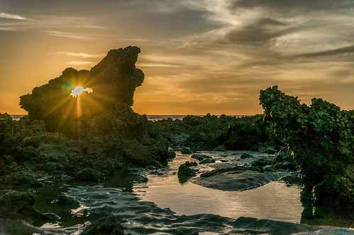 sunset beach water rocks nt australia darwin