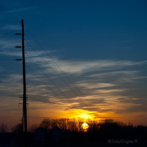 blue sunset sky orange silhouette sign clouds tracks utilitypole railroadcrossing