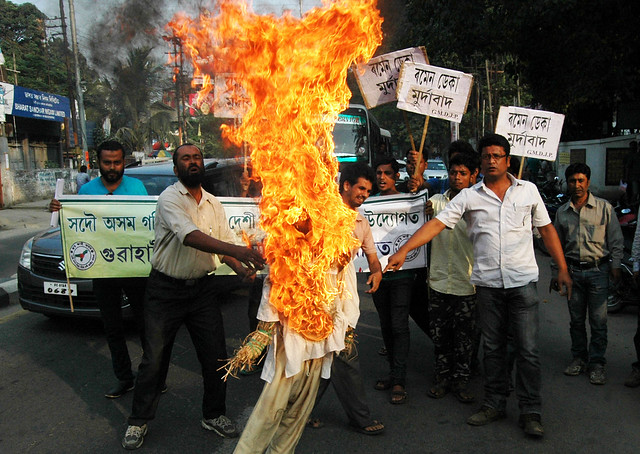 Members of Sadou Asom Goria Moria Deshi Jatiya Parishad burn effigy of BJP MP Ramen Deka