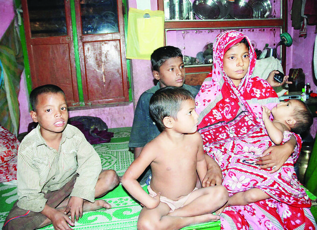Wife of victim Kurpan Shah Arjina Begum with her children.