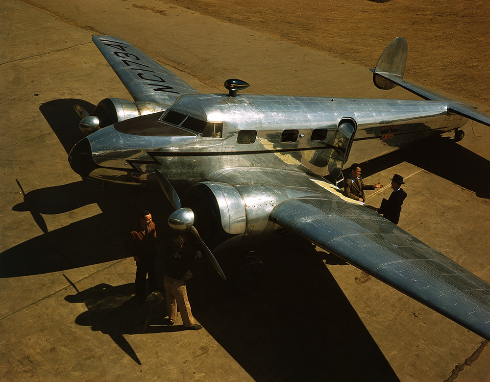 [Four Men with a Lockheed 12A Electra Junior]