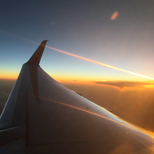 sunset fire airplane southwest orange sky blue rays abovetheclouds flying flight