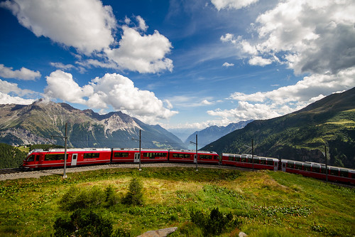 blue red italy panorama mountain lake green grass clouds train landscape switzerland day cloudy swiss wide stmoritz rhb photovotr