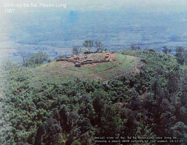 Aerial view of Nui Ba Ra Mountain, near Song Be, showing a small ARVN outpost at the summit. 14 Dec 1967