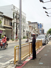 Phuket Hungry Ghost Festival 2012 - Policeman keeping an eye on things.