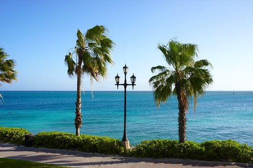 ocean sun beach island lights hotel aruba palmtrees lightpost