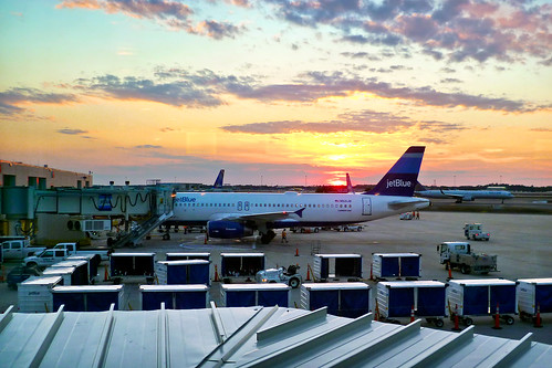 sunset clouds orlando airport rainbow twilight skies jetblue airlines runway mco