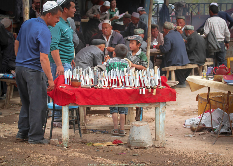 Handmade knives for sale  inside the Sunday Livestock Market in Kashgar