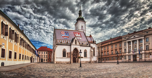 zagreb croatia sky clouds panorama city urban church parliament government square stmarks architecture building cobblestone historic storm weather day morning flag roof tiles spire pointofinterest