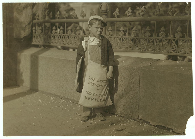 Freddie Kafer, a very immature little newsie selling Saturday Evening Posts and newspapers at the entrance to the State Capitol.... Sacramento, California (LOC)