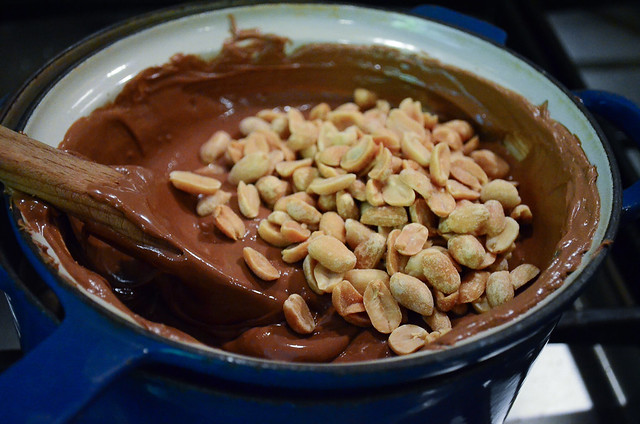 Peanuts are added to the melted chocolate.