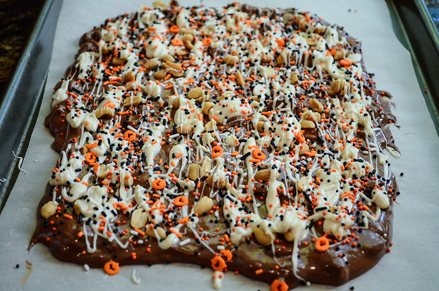 Halloween themed sprinkles are added to the top of the chocolate mixture.