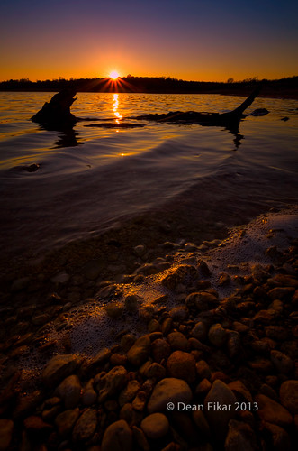 sunset lake twilight rocks texas unitedstates horizon foam serene ripples sunrays fortworth goldenhour treestumps lateafternoonlight benbrooklake