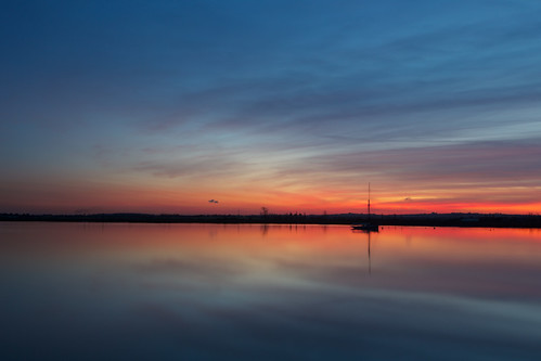 sunset red sky orange cloud black reflection water silhouette boat essex heybridgebasin countyofessex