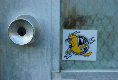 Silver door on the garden door, sticker "Fiat Slug, University of California at Santa Cruz", San Mateo, California, USA by Wonderlane
