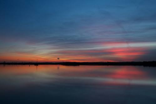 sunset red sky orange cloud black reflection water silhouette boat essex heybridgebasin