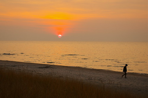 sunset lake water silhouette person photo alone sundown walk horizon lakeshore solitary lakehuron nancyarmstrongt