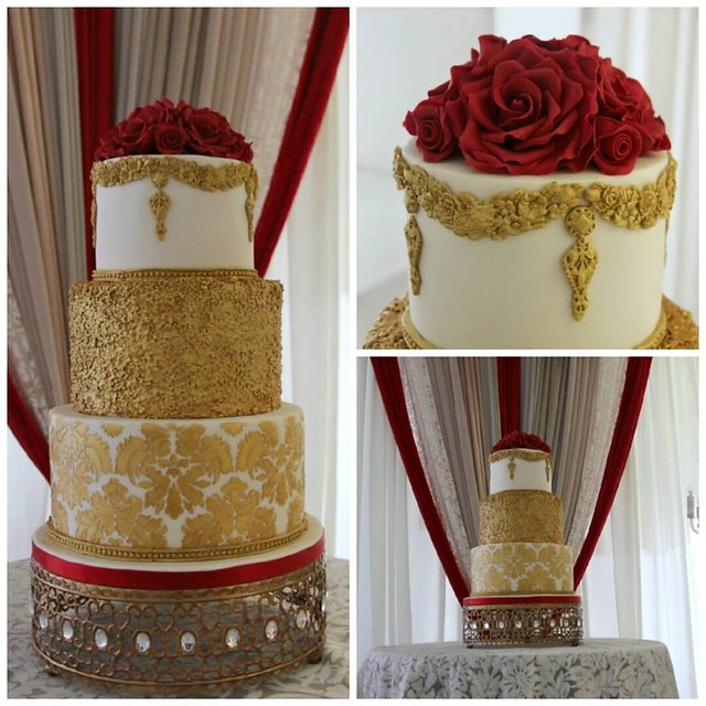 Wedding Cake-Ivory and gold with deep red sugar roses by Pretty Cake Boutique