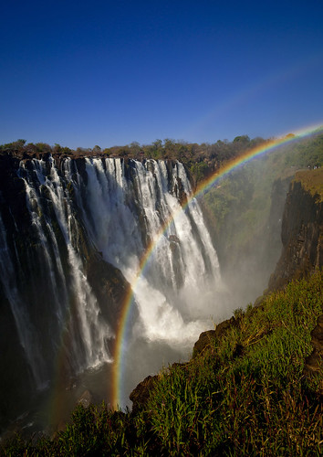 africa nature vertical landscape outside outdoors rainbow exterior bluesky nopeople victoriafalls cascade zambia colorphoto livingstone southernafrica 699