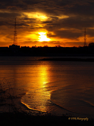 sunset orange reflection tower water silhouette reflections river gold golden glow sundown dusk ripple towers alabama silhouettes sunsets southern reflected rivers decatur waters glowing ripples thesouth microwave dixie silhouetted antenna antennae waterway shimmering antennas shimmer tennesseeriver settingsun microwaves morgancounty limestonecounty navigable