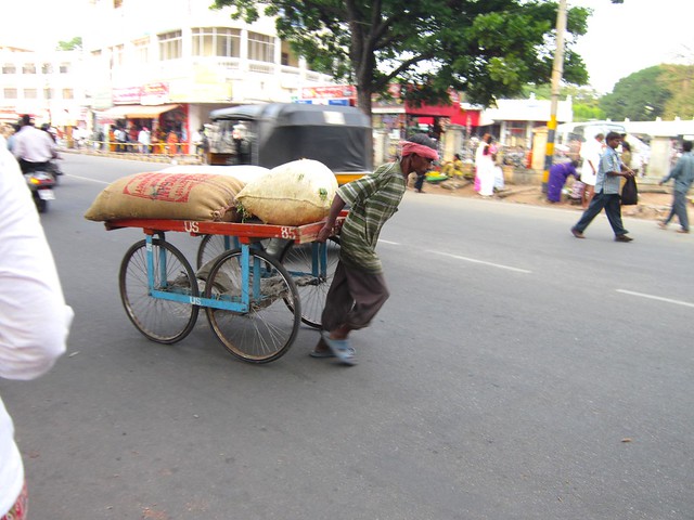 man pulling cart