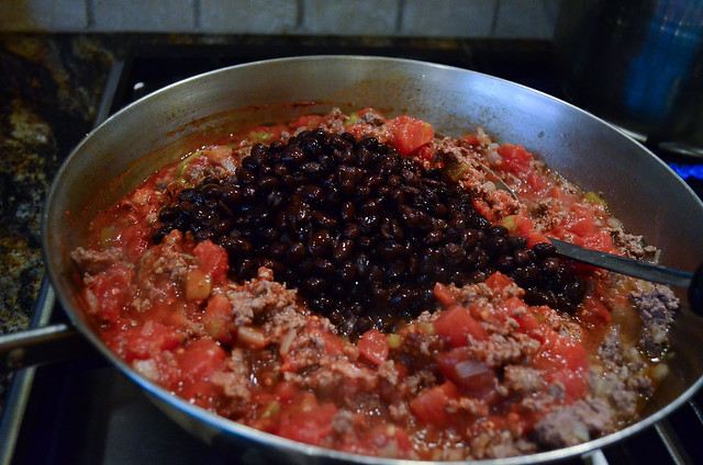 Black beans are added top the ground beef mixture.