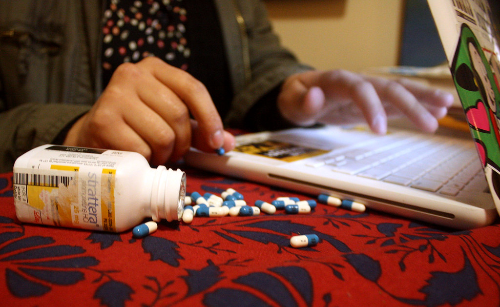 The prescription drug Strattera is a common focusing drug used to treat ADHD and is similar to Adderall or Ritalin. Students often use these drugs for late night studying or essay writing. Photo by Maggie Rose Ortins / Special to Xpress 