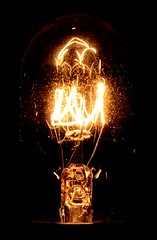 Is an electric light which produces light with a filament wire heated to a high temperature by an electric current passing through it, until it glows.
Ex. Lamp