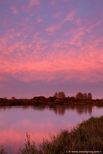 uk sunset red england sky cloud lake reflection nature water field grass landscape evening countryside europe view outdoor dusk scenic nobody cotswolds cotswoldwaterpark