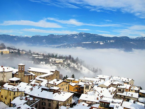 italy cityscape bergamo birdseyeview lombardy medievaltown winterimpression whiteroofs townonahill foginthevalley orobianprealps